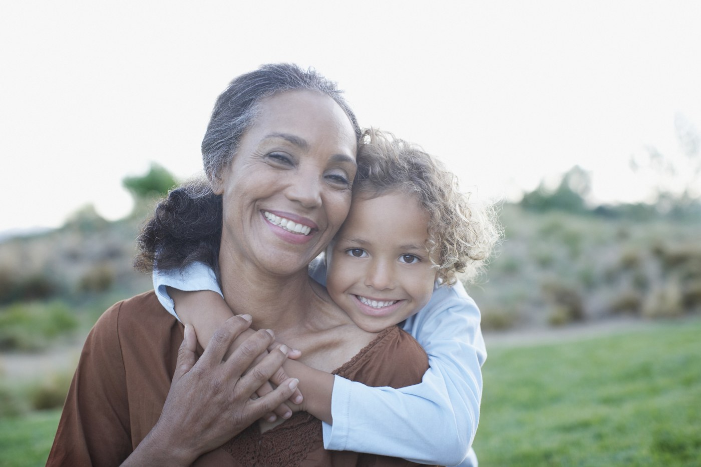 A grandmother and child sharing a warm embrace